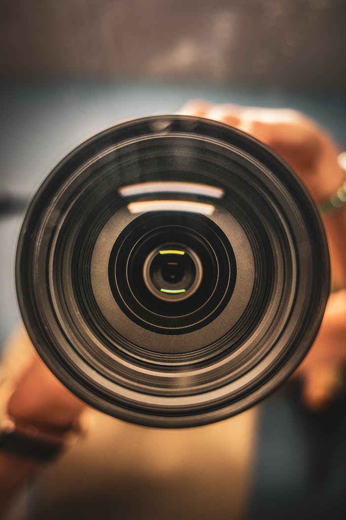 creative-02 Detailed macro view of a camera lens focusing mechanism.